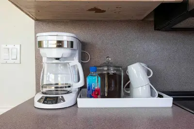 a kitchen counter with a coffee maker and a blender at Sunset Balcony Views 1 Mile to Beach 7 Beds in San Diego