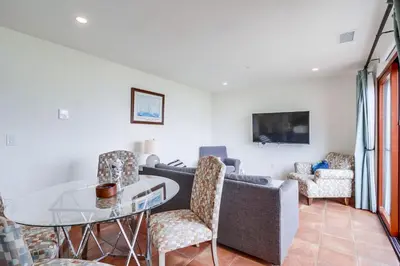 a living room with a couch and a table and chairs at Casa Hermosa in San Diego