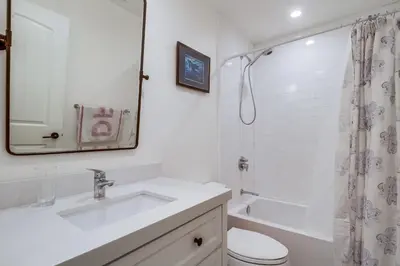 a bathroom with a sink and a toilet and a shower at Casa Hermosa in San Diego