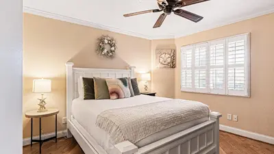 a bedroom with a white bed and a ceiling fan at Close to Beach w Patio Resort Amenities The Point at Corniche by AvantStay STR16-0458 in Dana Point