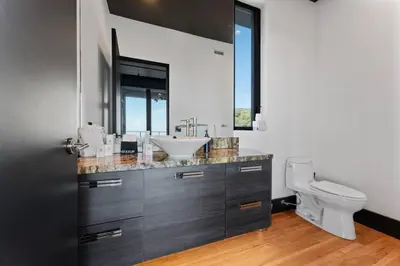 a bathroom with a sink and a toilet at Secluded Dream Home with Hot Tub and Full Gym on 20 Acres in Palomar Mountain
