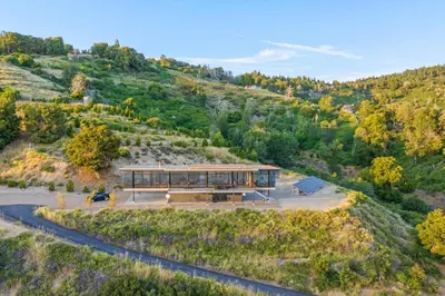 an aerial view of a house on a hill at Secluded Dream Home with Hot Tub and Full Gym on 20 Acres in Palomar Mountain