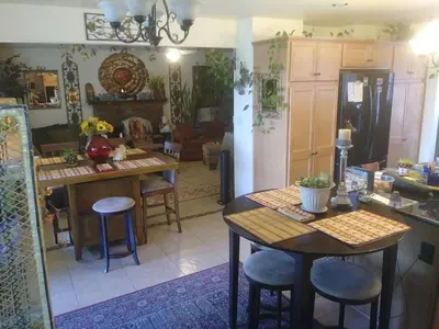a kitchen and living room with a table and chairs at Comfortable Home in San Diego Lemon Grove Area in Lemon Grove