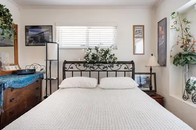 a bedroom with a large white bed in a room at Comfortable Home in San Diego Lemon Grove Area in Lemon Grove
