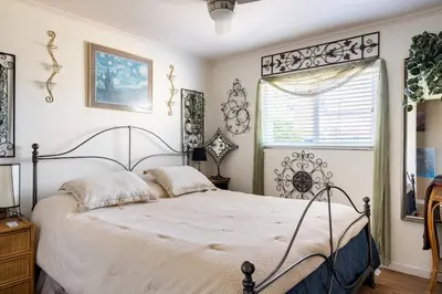 a bedroom with a large bed and a window at comfortable home in San Diego Lemon Grove area in Lemon Grove