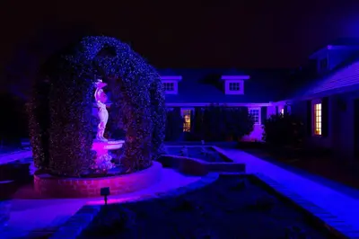 a statue in the yard of a house at night at Enchanted Estate With Animals Lightscapes and Whimsy in Bonsall