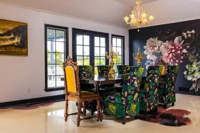 a dining room with a table and chairs at Enchanted Estate With Animals Lightscapes and Whimsy in Bonsall