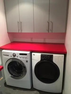 a kitchen with a white washing machine and a red counter at Room in Bay Park, San Diego in San Diego