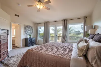 a bedroom with a bed and a large window at Casa da Saudade in Temecula