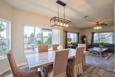 a dining room with a wooden table and chairs at Casa da Saudade in Temecula