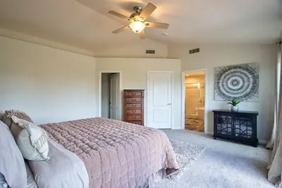 a bedroom with a bed and a ceiling fan at Casa da Saudade in Temecula