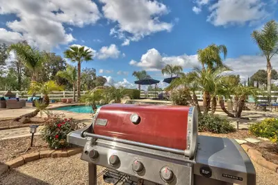 a toaster sitting on a table next to a pool at Casa da Saudade in Temecula