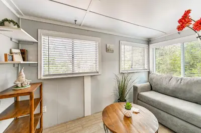 a living room with a couch and a table at Near Hiking and Mtn Biking Cozy Cabin in Mt Laguna! in Mount Laguna