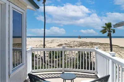 a balcony of a house with a view of the beach at Oceanfront Escape with Breathtaking Views in Newport Beach