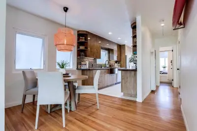 a kitchen and dining room with a table and chairs at Bali Beach in San Diego