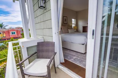 a room with a bed and a bed and a window at Leucadia Paradise in Encinitas