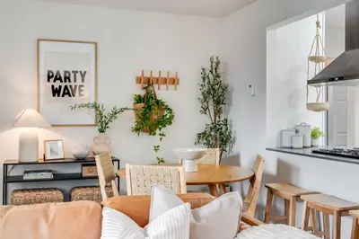 a living room with a couch and a table at NEW Boho-Beach House in San Diego