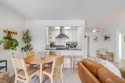 a kitchen and living room with a table and a couch at NEW Boho-Beach House in San Diego