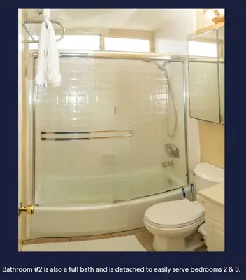 a bathroom with a shower with a toilet and a sink at Ocean Front Beauty right above Best Beach in Mission Beach, San Diego! in San Diego