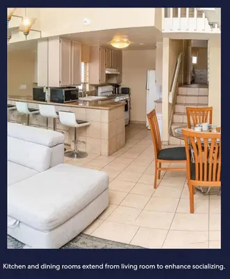 a kitchen and dining rooms seen from living room to entrancealsh at Ocean Front Beauty right above Best Beach in Mission Beach, San Diego! in San Diego