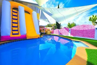 a swimming pool with a ladder in the middle at Casa de Bloom Venue - Your Perfect Event Space in San Diego