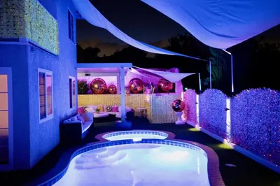 a room with a swimming pool with purple lights at Casa de Bloom Venue - Your Perfect Event Space in San Diego