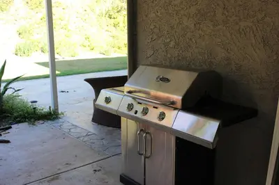 a stove top oven sitting next to a wall at Tropical retreat for whole family Fresh eggs Made to Entertain in Carlsbad