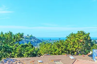 a view of roofs of houses and trees at Viewpoint Villa - VILLA105 in Solana Beach