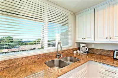 a kitchen with a sink and a window at Viewpoint Villa - VILLA105 in Solana Beach