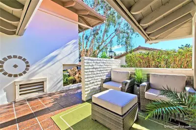 an outdoor patio with two chairs and a table at Viewpoint Villa - VILLA105 in Solana Beach