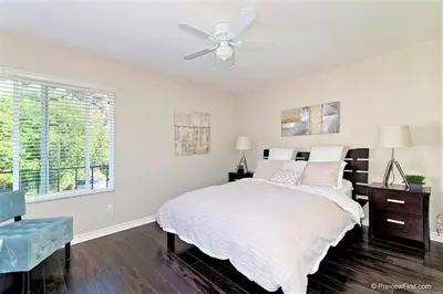 a bedroom with a bed and a ceiling fan at Viewpoint Villa - VILLA105 in Solana Beach