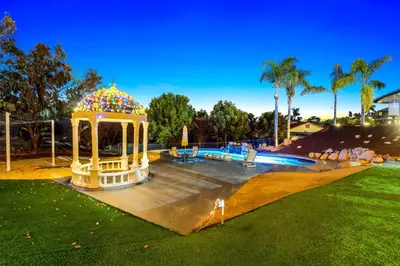 a gazebo in a yard with a pool at The Grand Vista Getaway in Vista