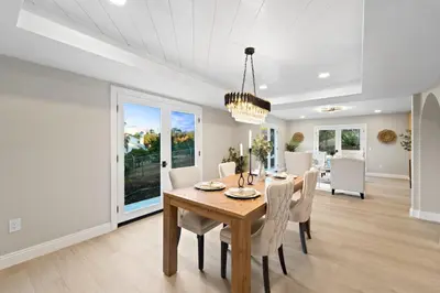 a dining room with a table and chairs at The Grand Vista Getaway in Vista