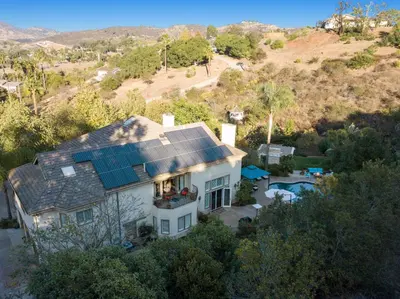 an aerial view of a house with solar panels on its roof at Buena Creek Refuge - Family Resort Destination - Secure and Private - in Vista