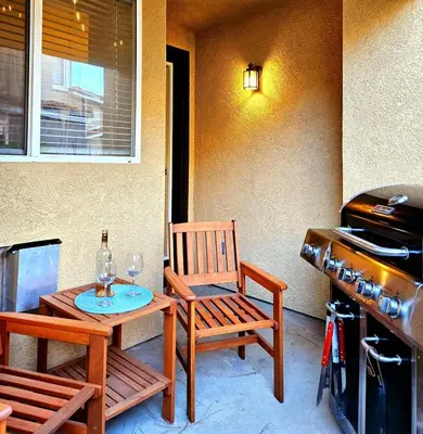 a patio with a table and chairs and a grill at Wine Country Reserves in Murrieta