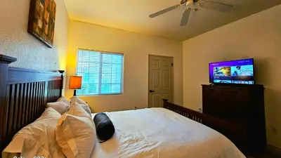 a bedroom with a bed and a flat screen tv at Wine Country Reserves in Murrieta