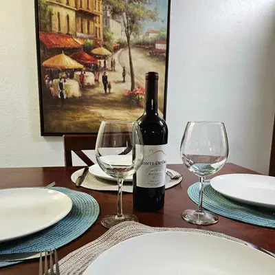 a bottle of wine sitting on a table with two glasses at Wine Country Reserves in Murrieta