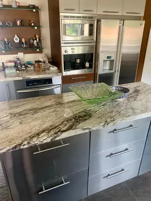 a kitchen with stainless steel appliances and a granite counter top at Rooms in Bay Park, San Diego in San Diego