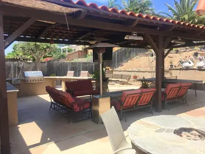 a patio with chairs and a table and a pavilion at Rooms in Bay Park, San Diego in San Diego