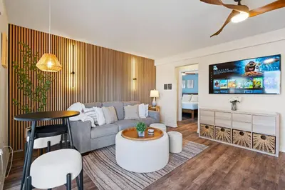 a living room with a couch and a table at 2 Bdrm Condo + Parking in Heart of Mission Beach! in San Diego