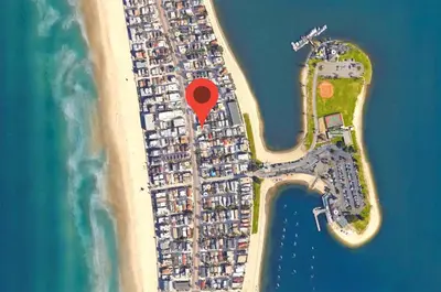 an island with a red marker on a beach at 2 Bdrm Condo + Parking in Heart of Mission Beach! in San Diego