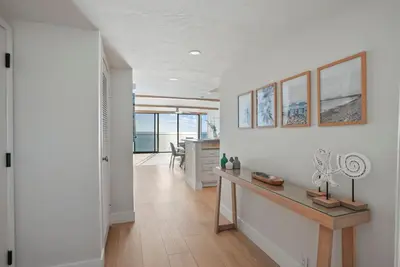 a home office with a desk and a view of the ocean at Oceanfront Paradise with Sunset Balcony, Pool, Spa, Beach Access and Parking in San Diego