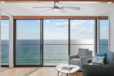 a living room with a view of the ocean at Oceanfront Paradise with Sunset Balcony, Pool, Spa, Beach Access and Parking in San Diego