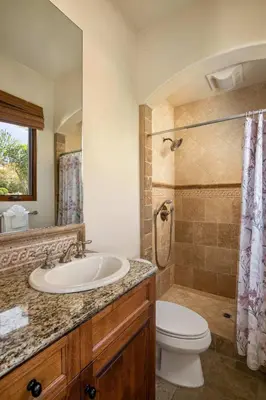 a bathroom with a sink and a toilet and a shower at 7BR Carlsbad Estate with Pool Firepit & Views in Carlsbad
