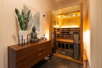 a room with a cabinet with a glass door at Large Home With Sauna in Vista