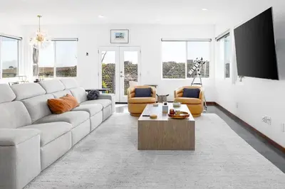 a living room with a couch and a tv at Large Home With Sauna in Vista