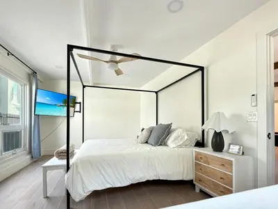 a bedroom with a bed and a ceiling fan at F-72 Terramar Cliffs in Carlsbad