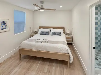 a bedroom with a bed with two towels on it at F-72 Terramar Cliffs in Carlsbad