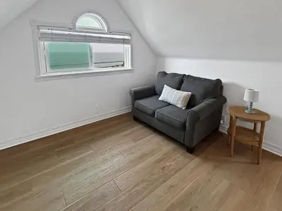 a living room with a couch and a window at F-72 Terramar Cliffs in Carlsbad
