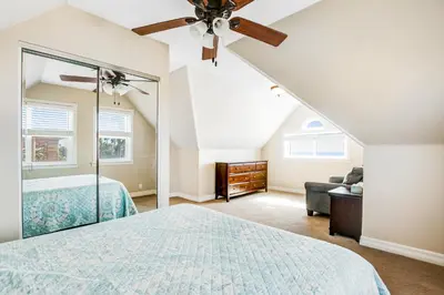 a bedroom with a bed and a ceiling fan at F-75 Terramar Cliffs in Carlsbad